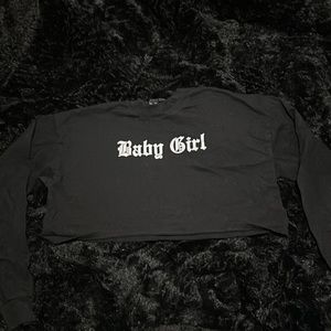 Black cropped long sleeve shirt.